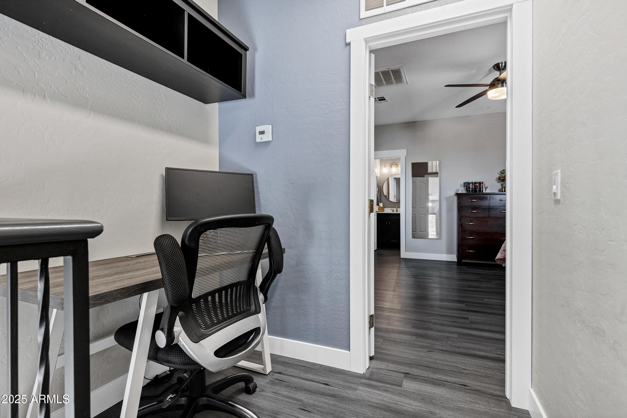 945 West Wendy Way Gilbert, AZ 85233 - Photo 23 of 35 a view of a hallway with couch and wooden floor