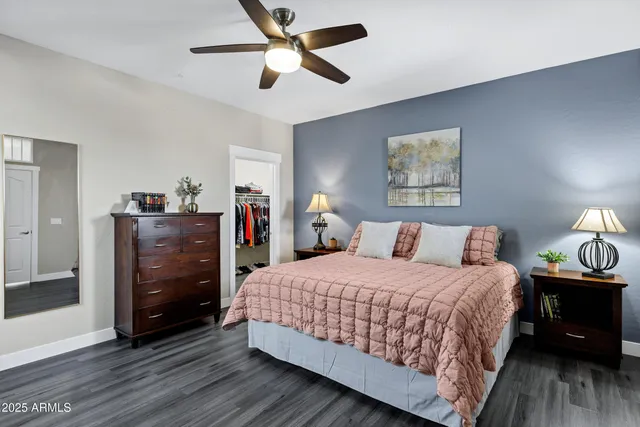 a bedroom with a bed and a walk in closet