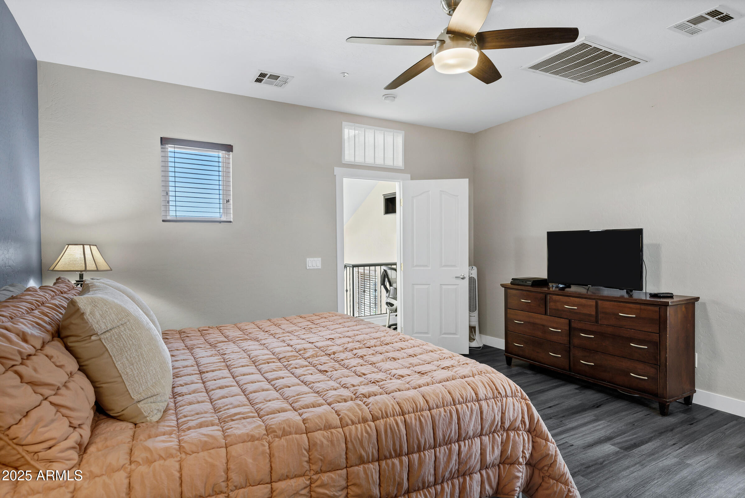 945 West Wendy Way Gilbert, AZ 85233 - Photo 25 of 35 a bedroom with a bed and a flat screen tv