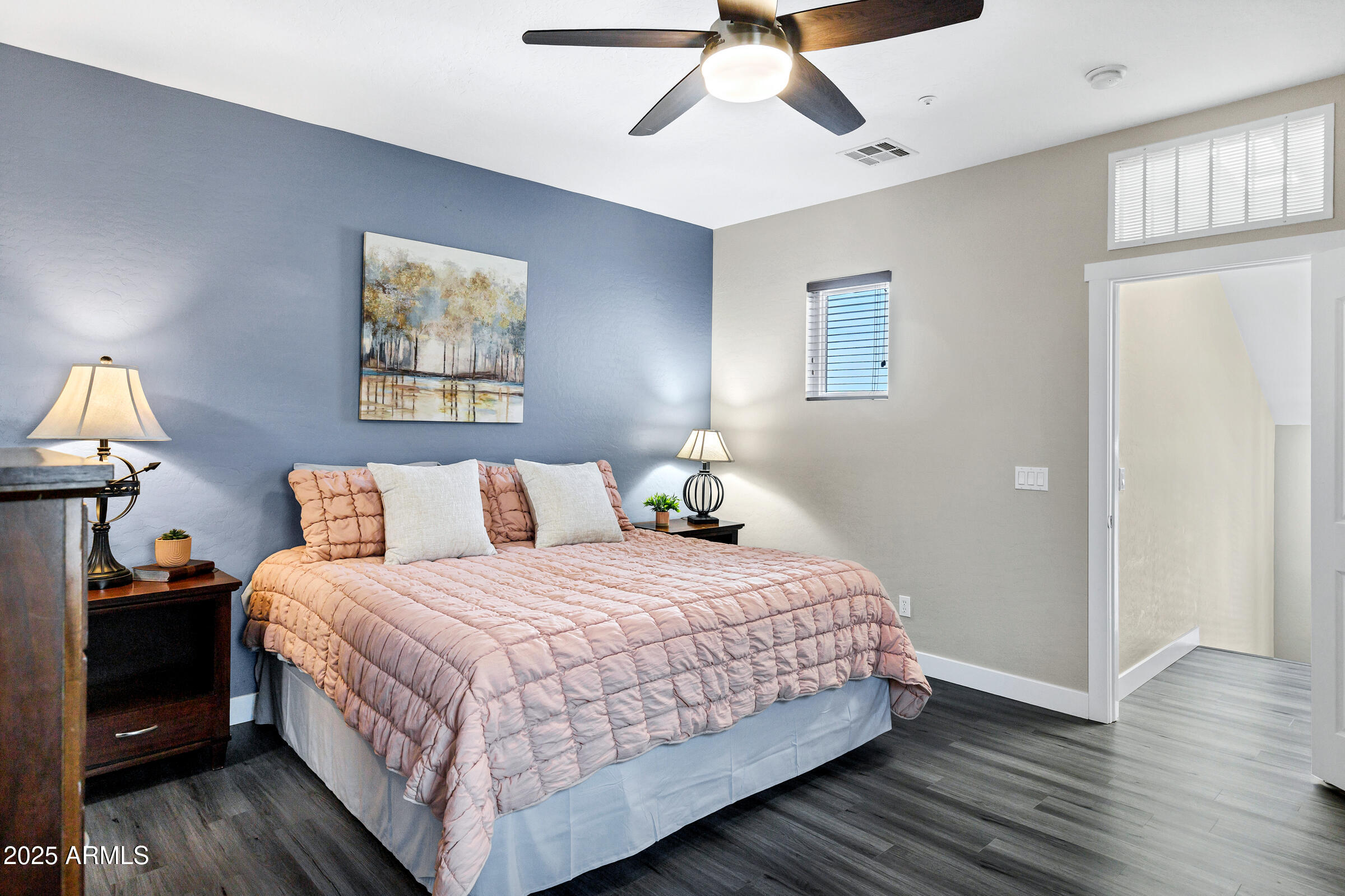 945 West Wendy Way Gilbert, AZ 85233 - Photo 26 of 35 a bedroom with a bed and wooden floor