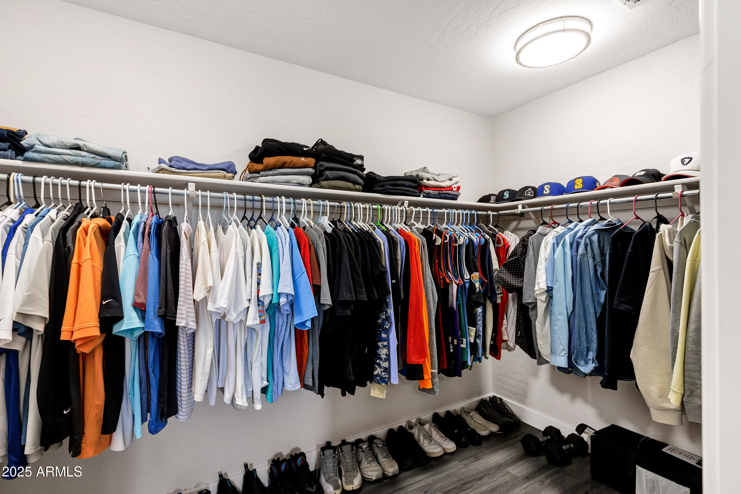 945 West Wendy Way Gilbert, AZ 85233 - Photo 27 of 35 a view of walk in closet with clothes