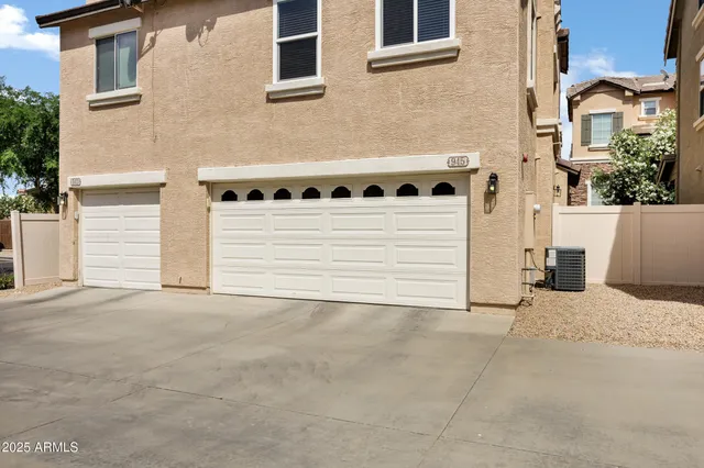 a view of a house with a white wall and roof