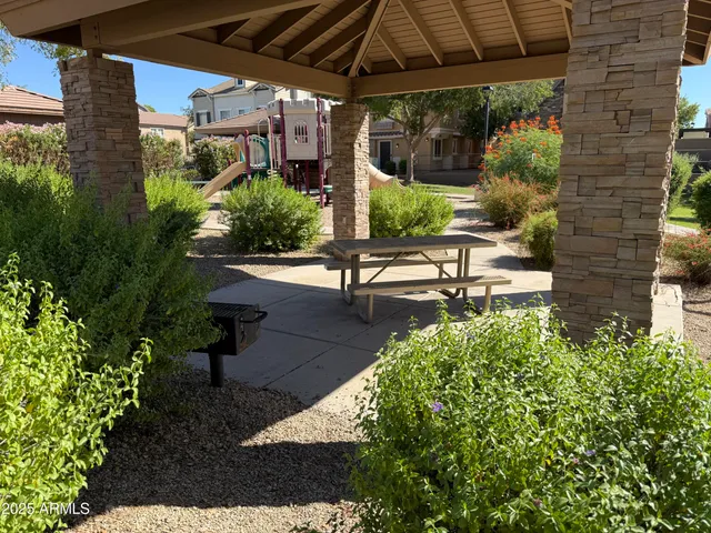 a view of a backyard with sitting area