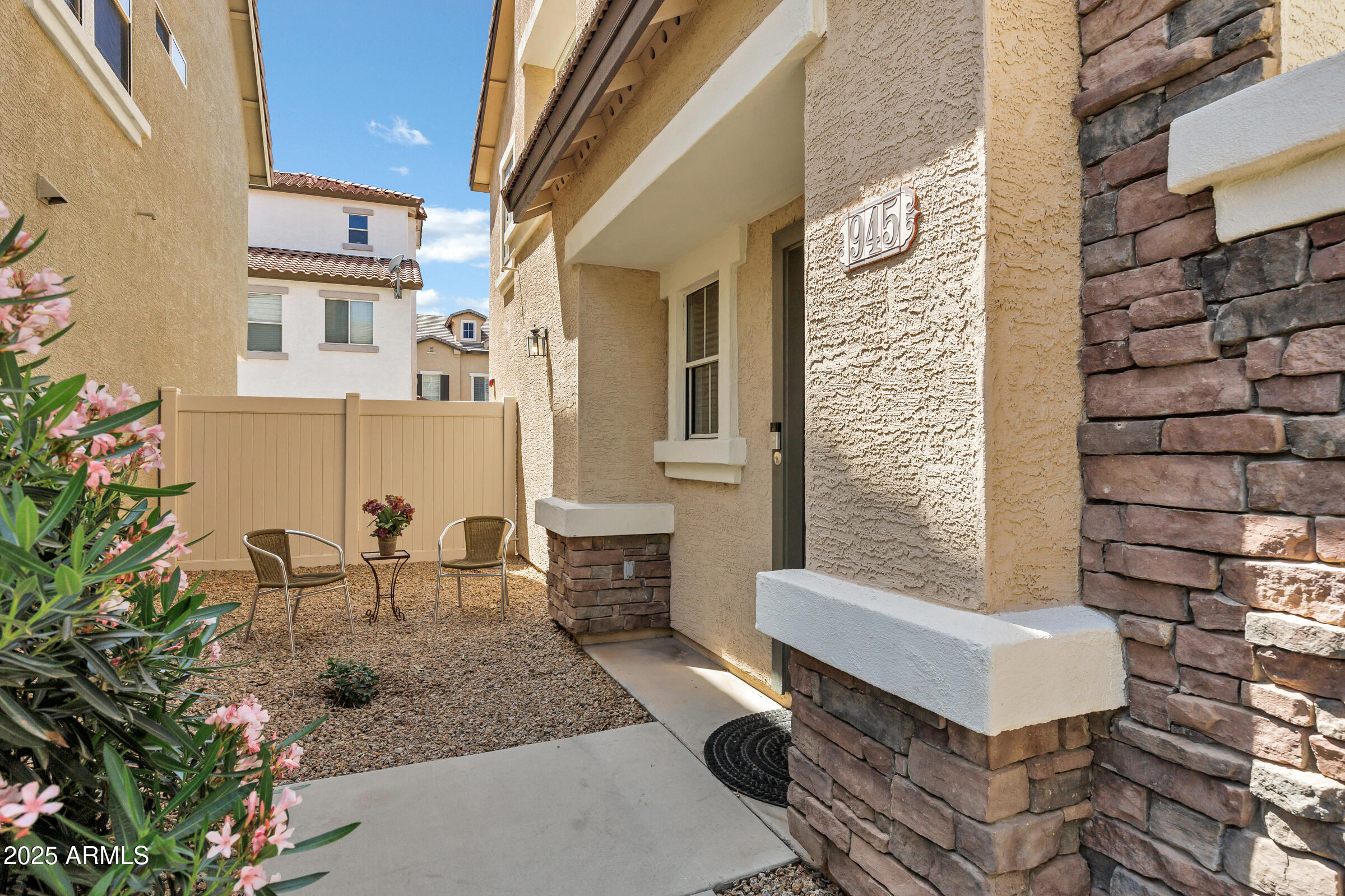 945 West Wendy Way Gilbert, AZ 85233 - Photo 4 of 35 a view of a patio with couches table and chairs and potted plants