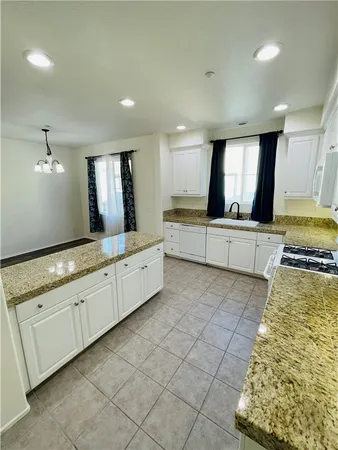 a large bathroom with a large tub and sink