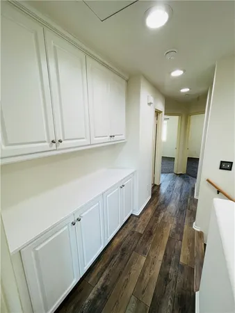 a view of a kitchen with wooden floor