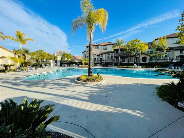 a view of a swimming pool with a patio