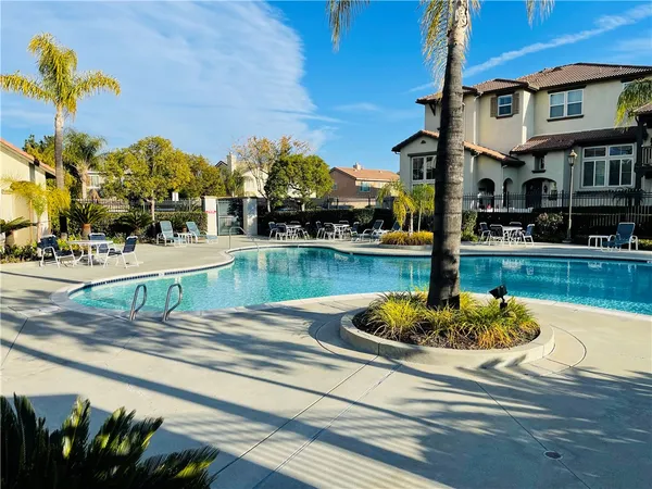 a view of a swimming pool with a lounge chairs
