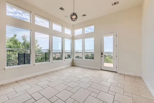 a view of an empty room with a window