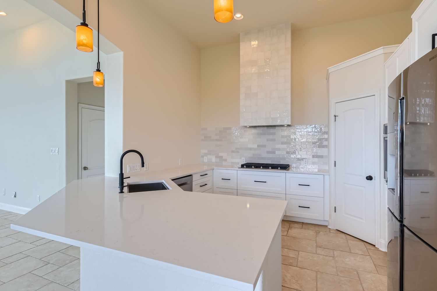 236 Aria Ridge, Unit 236 Lakeway, TX 78738 - Photo 2 of 24 a kitchen with stainless steel appliances a sink cabinets and a refrigerator