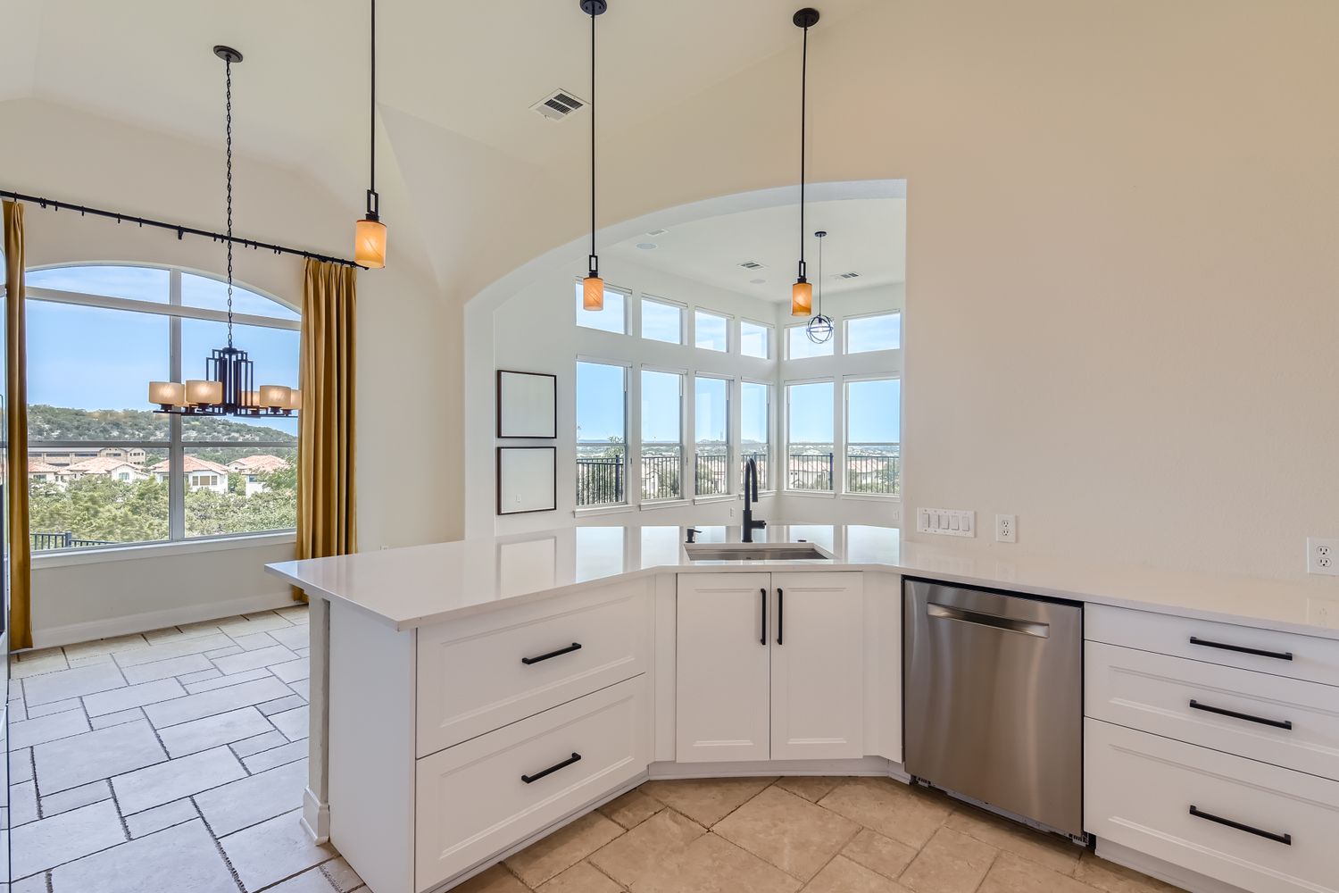 236 Aria Ridge, Unit 236 Lakeway, TX 78738 - Photo 3 of 24 a kitchen with stainless steel appliances granite countertop a sink a stove and a window