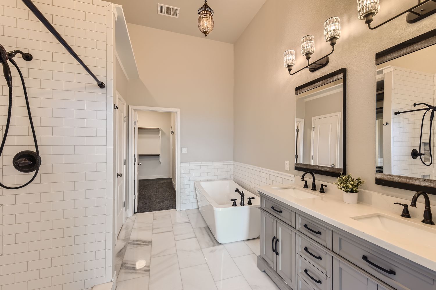 236 Aria Ridge, Unit 236 Lakeway, TX 78738 - Photo 9 of 24 a bathroom with a double sink shower and a mirror