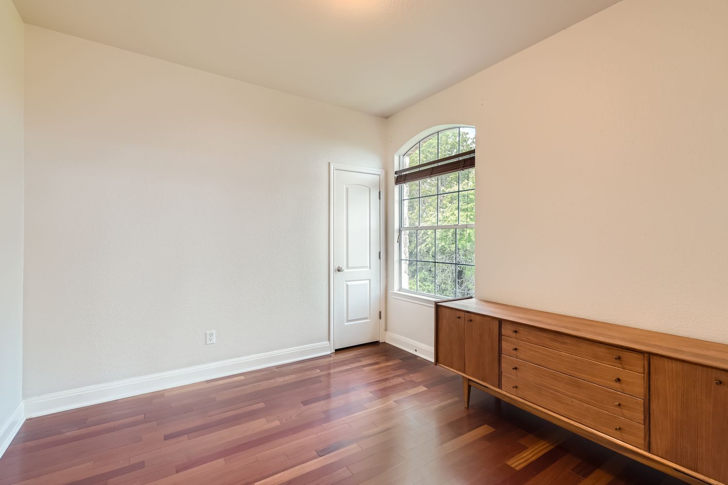 236 Aria Ridge, Unit 236 Lakeway, TX 78738 - Photo 10 of 24 an empty room with wooden floor and window