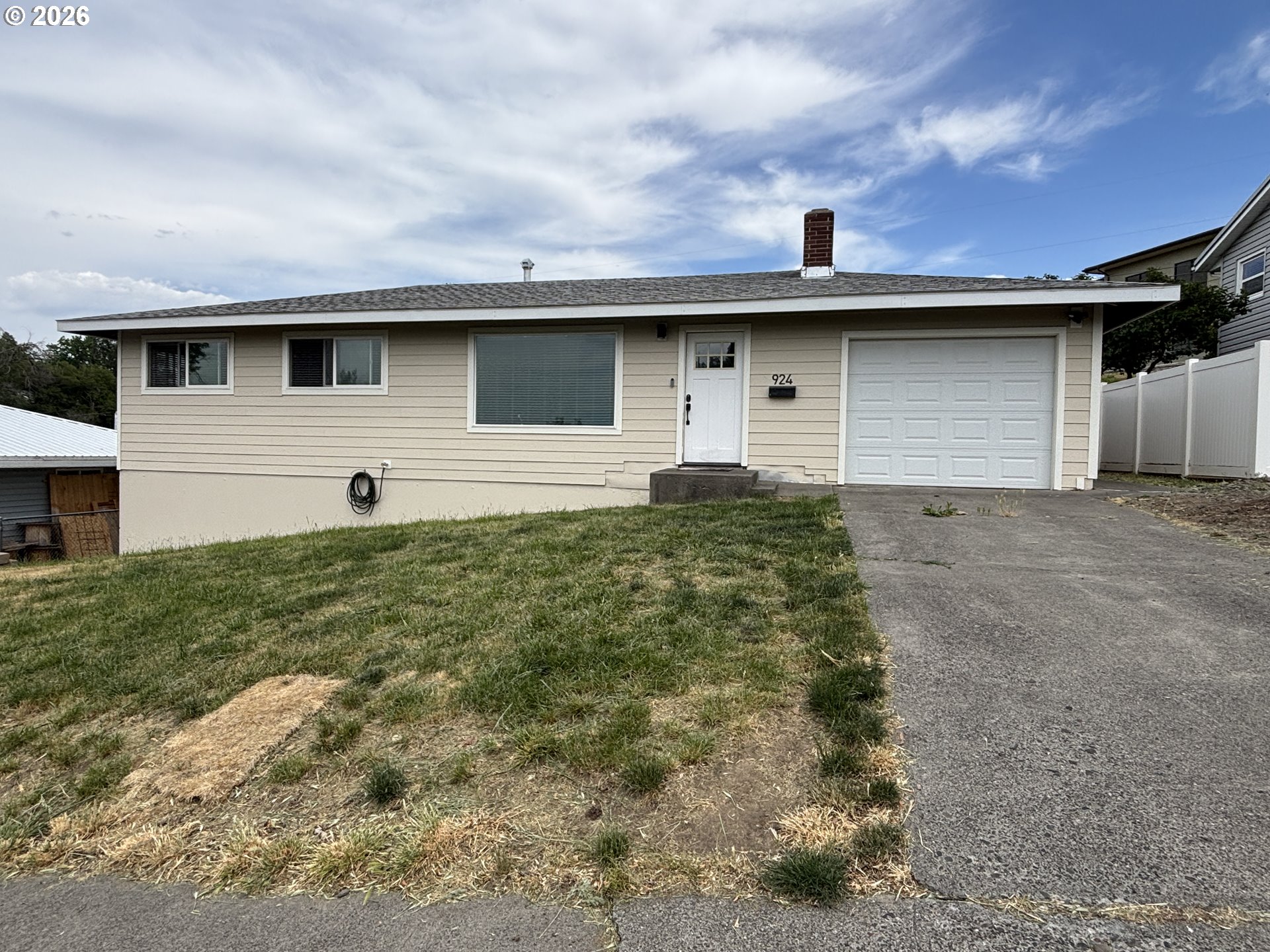 a front view of a house with garage