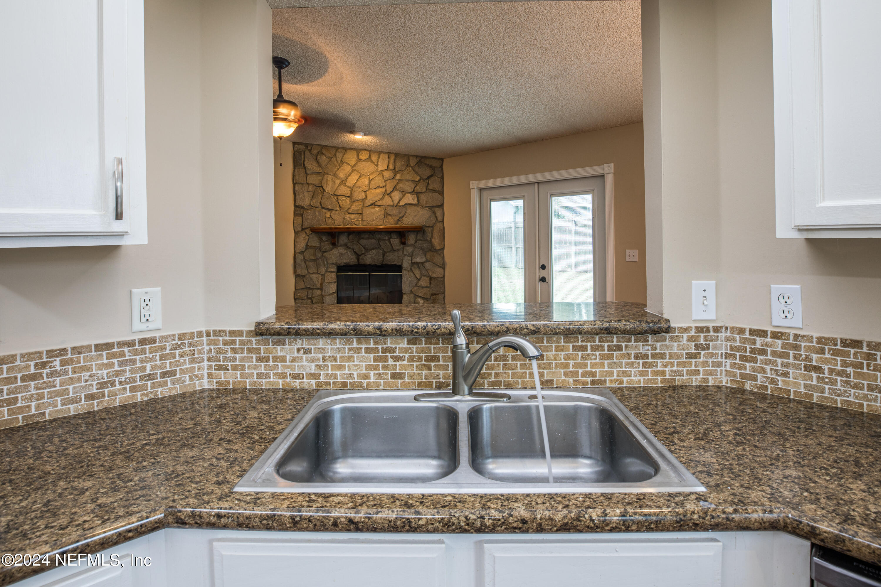 8691 Hammond Forest Drive Jacksonville, FL 32221 - Photo 15 of 28 a kitchen with a sink and cabinets