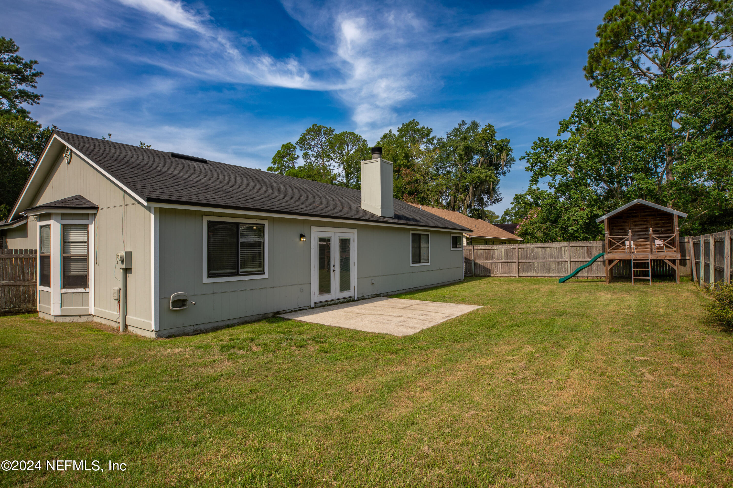 8691 Hammond Forest Drive Jacksonville, FL 32221 - Photo 23 of 28 a front view of a house with a yard