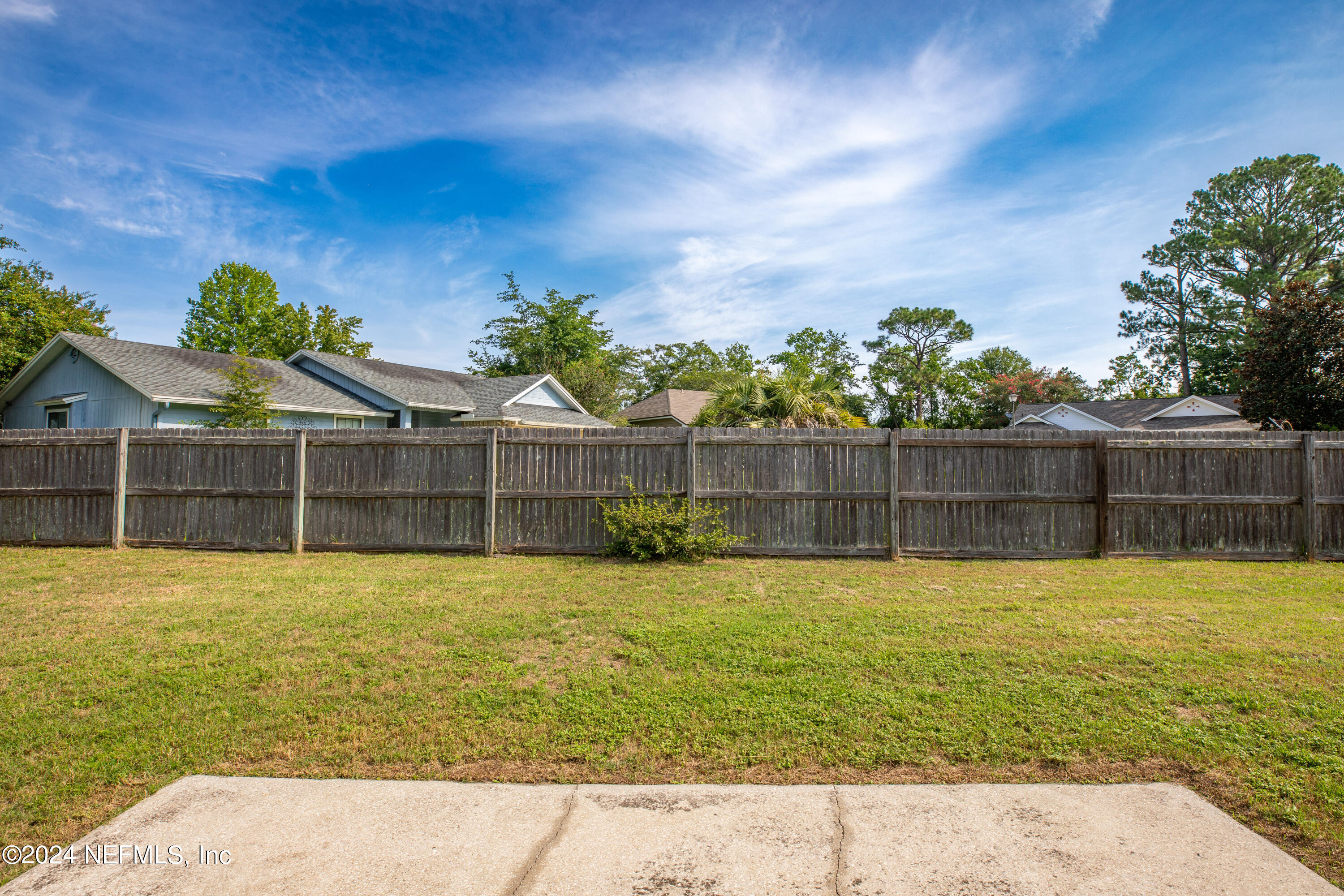 8691 Hammond Forest Drive Jacksonville, FL 32221 - Photo 24 of 28 a view of a swimming pool with a yard