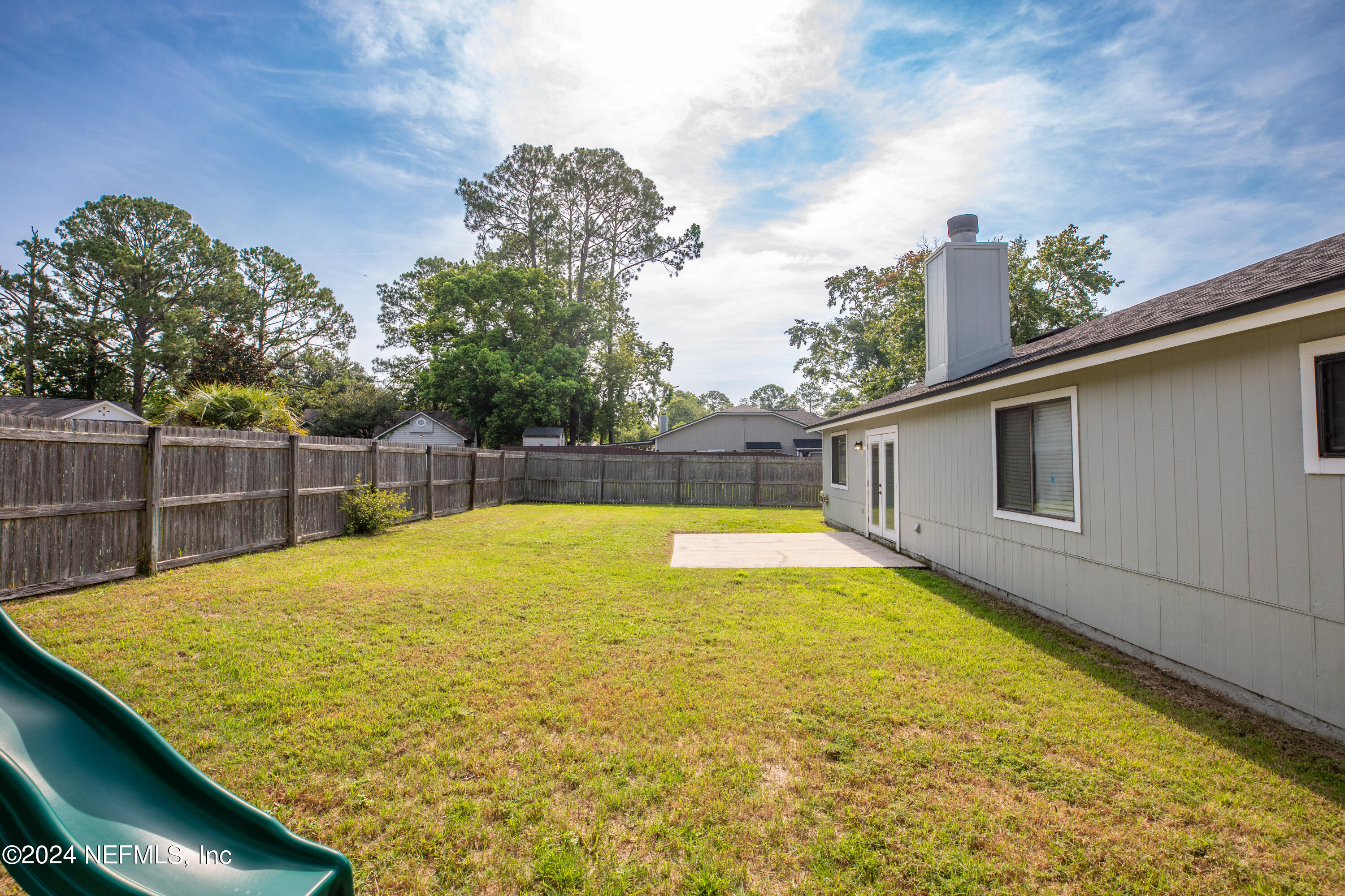 8691 Hammond Forest Drive Jacksonville, FL 32221 - Photo 25 of 28 a swimming pool that is in front of a building