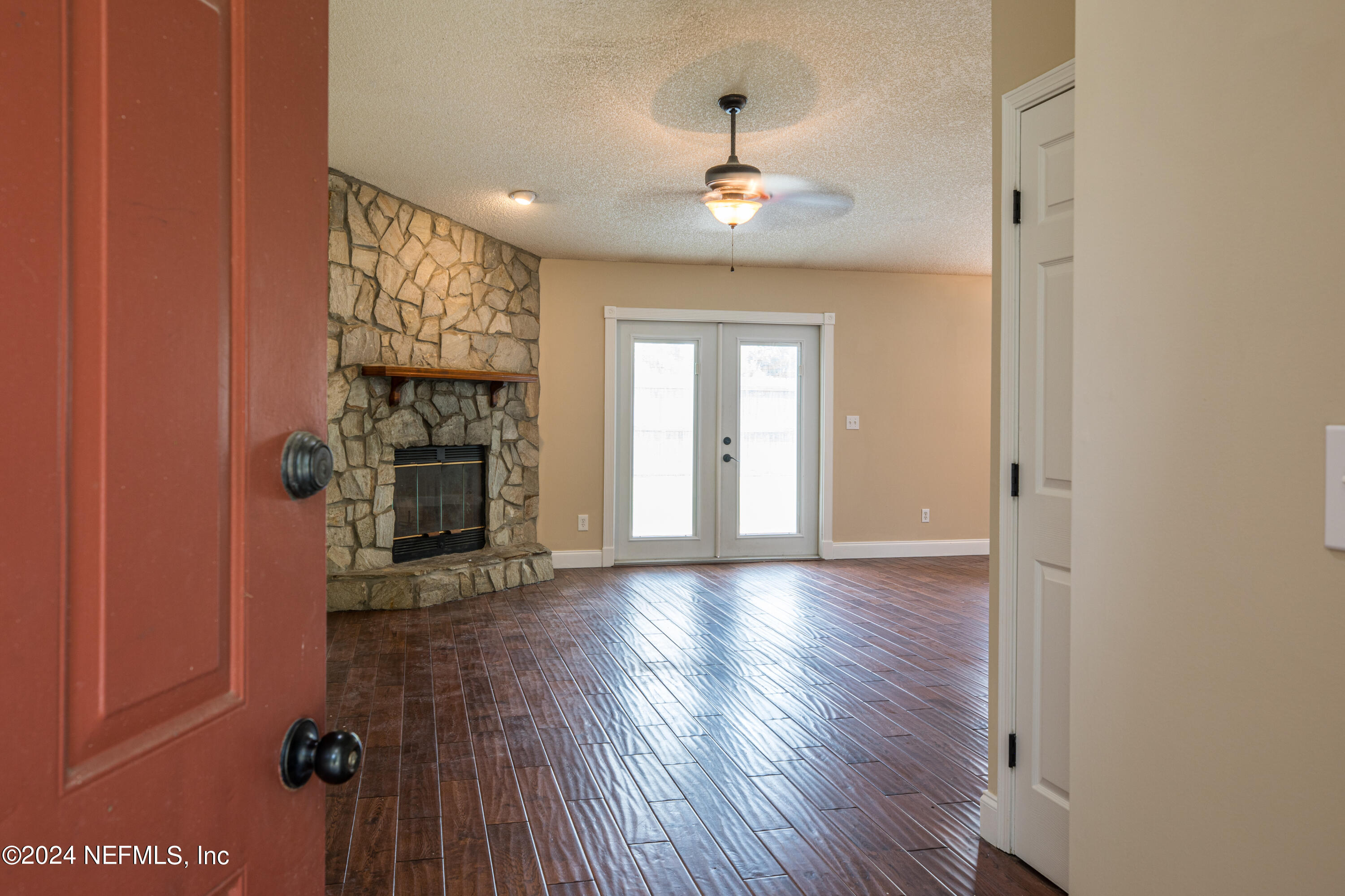8691 Hammond Forest Drive Jacksonville, FL 32221 - Photo 7 of 28 wooden floor in an empty room with a window
