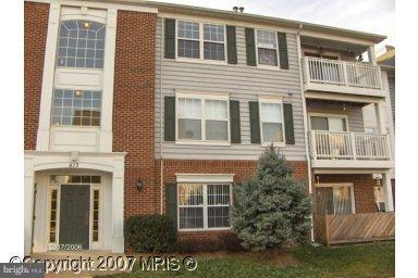 673 Constellation Square Southeast, Unit J Leesburg, VA 20175 - Photo 1 of 25 a front view of a house with a yard