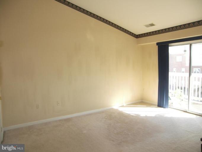 673 Constellation Square Southeast, Unit J Leesburg, VA 20175 - Photo 22 of 25 a view of an empty room with a window