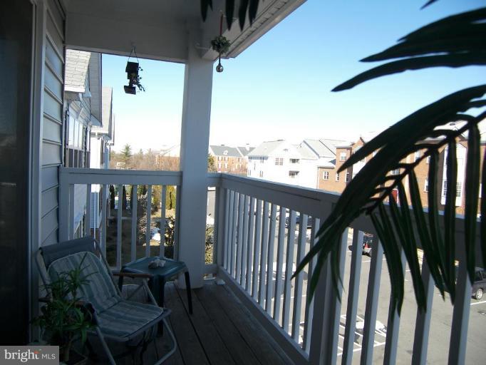 673 Constellation Square Southeast, Unit J Leesburg, VA 20175 - Photo 25 of 25 a view of a balcony with chairs