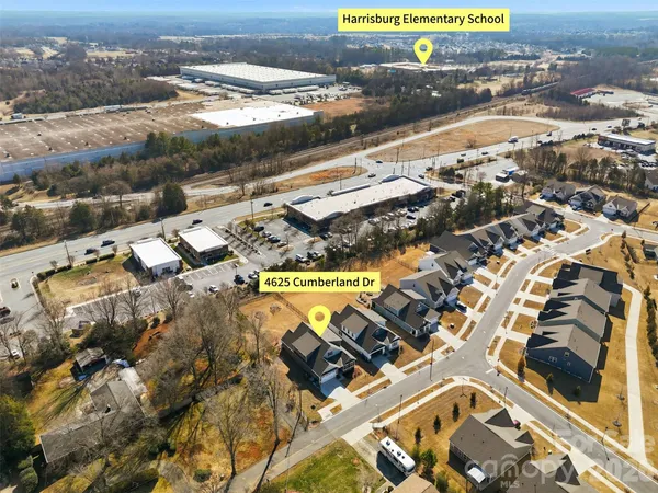 an aerial view of residential building and parking space