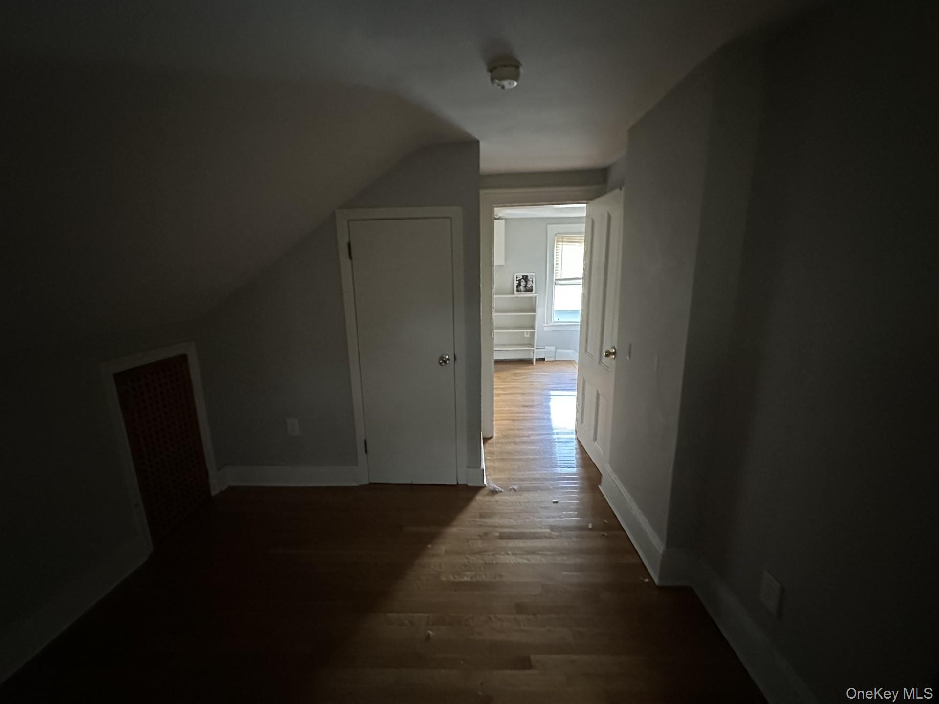 10 Prospect Street Nyack, NY 10960 - Photo 4 of 7 Additional living space with dark wood-type flooring and lofted ceiling