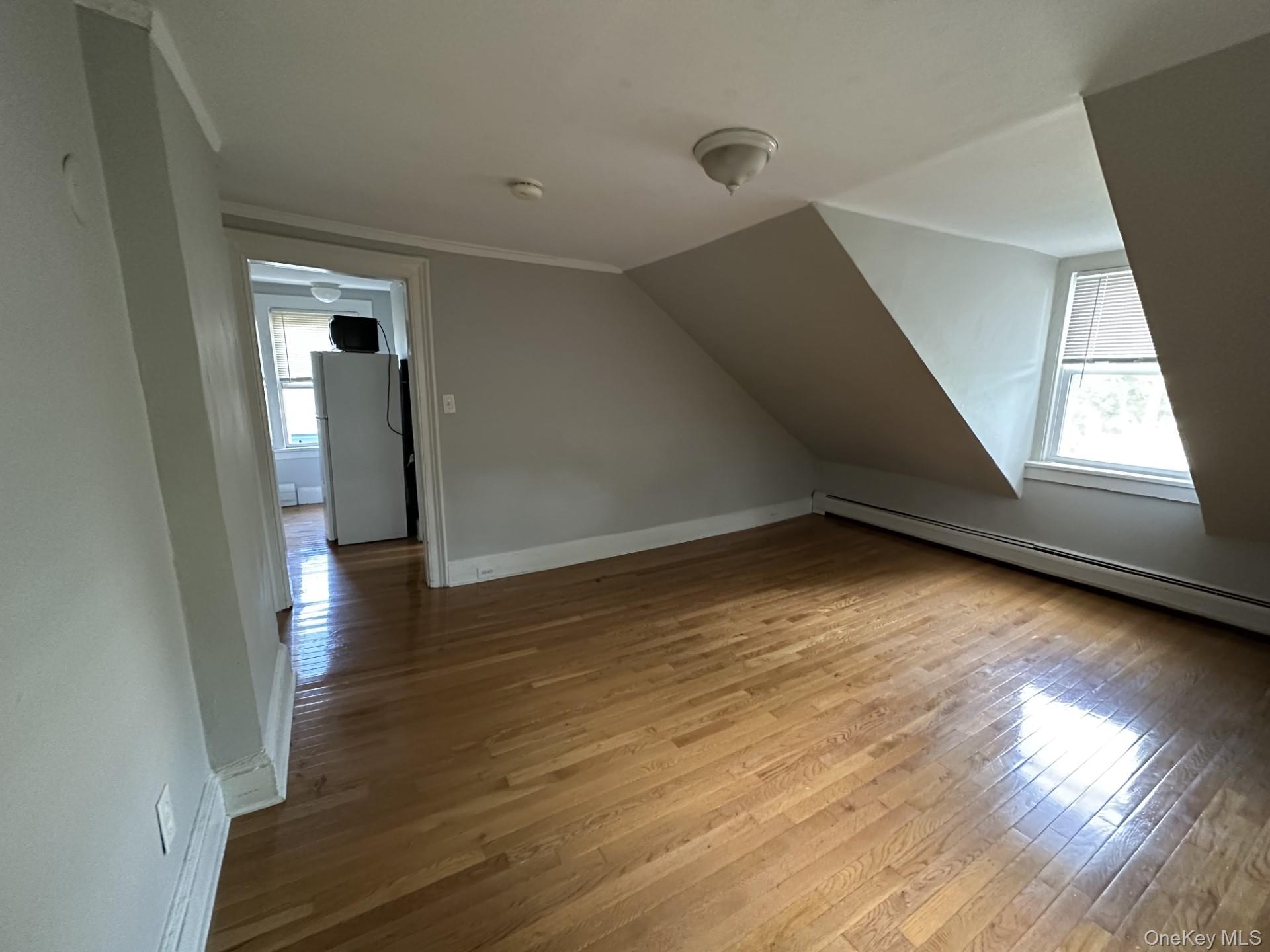 10 Prospect Street Nyack, NY 10960 - Photo 5 of 7 Additional living space featuring light wood finished floors, lofted ceiling, and baseboard heating