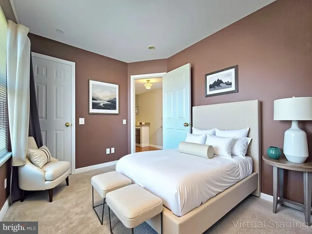 a bedroom with a bed and couch