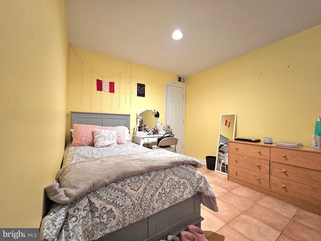 a bedroom with a bed and cabinets