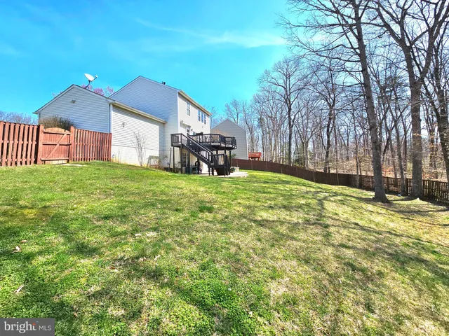 a view of a house with a yard and garage