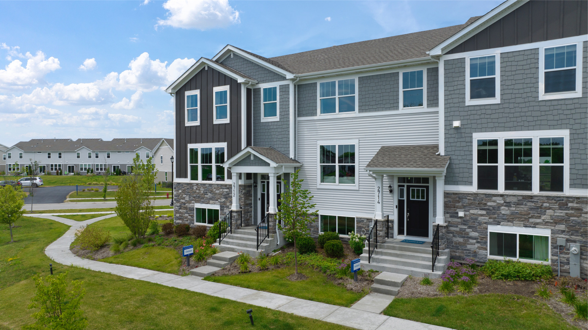 525 Wolverine Drive Aurora, IL 60502 - Photo 1 of 33 a front view of a house with a yard table and chairs
