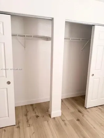 a white toilet sitting next to a bath tub