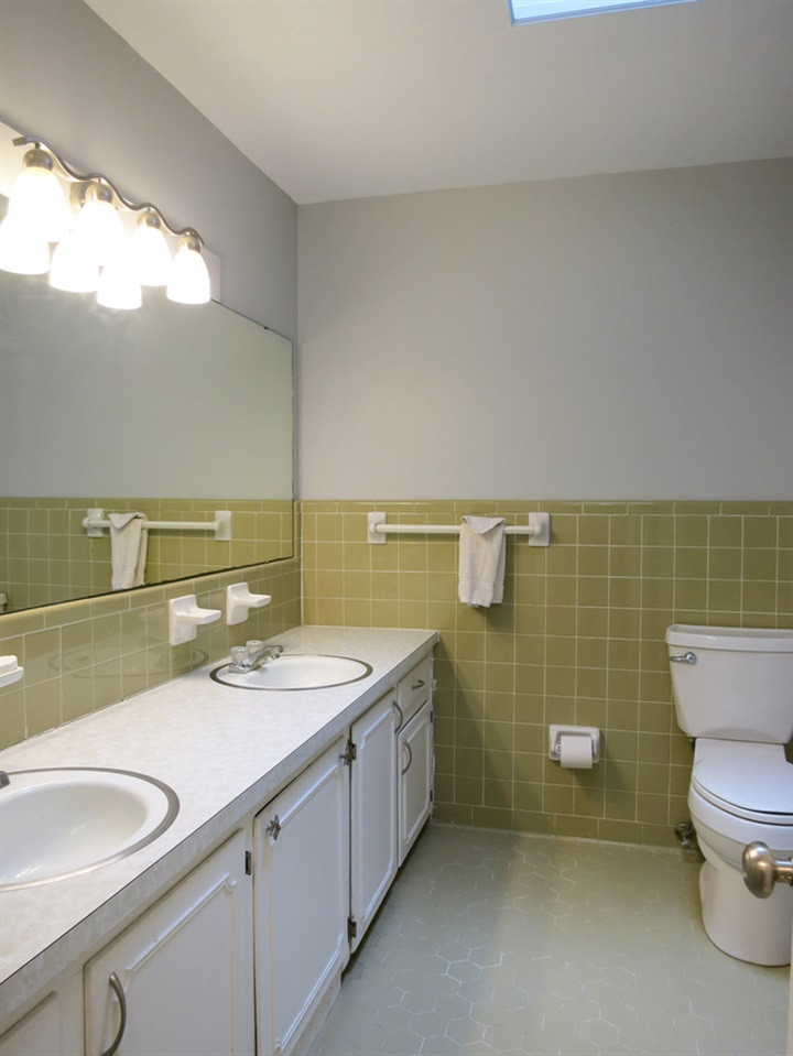 4101 Redington Drive Raleigh, NC 27609 - Photo 22 of 30 The 2 Bedrooms share the big Hall Bath w/tiled flr & walls, tiled tub/shower, linen closet, skylight & long vanity w/double sinks. Hall Bath