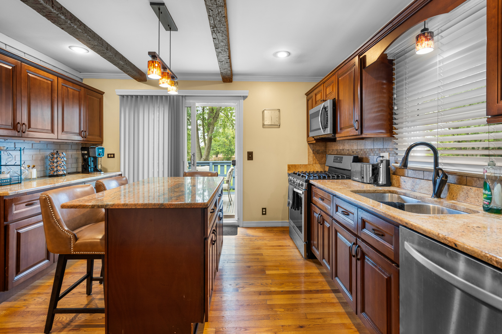 3479 Ronald Road Crete, IL 60417 - Photo 12 of 38 a kitchen with stainless steel appliances granite countertop sink stove top oven and cabinets