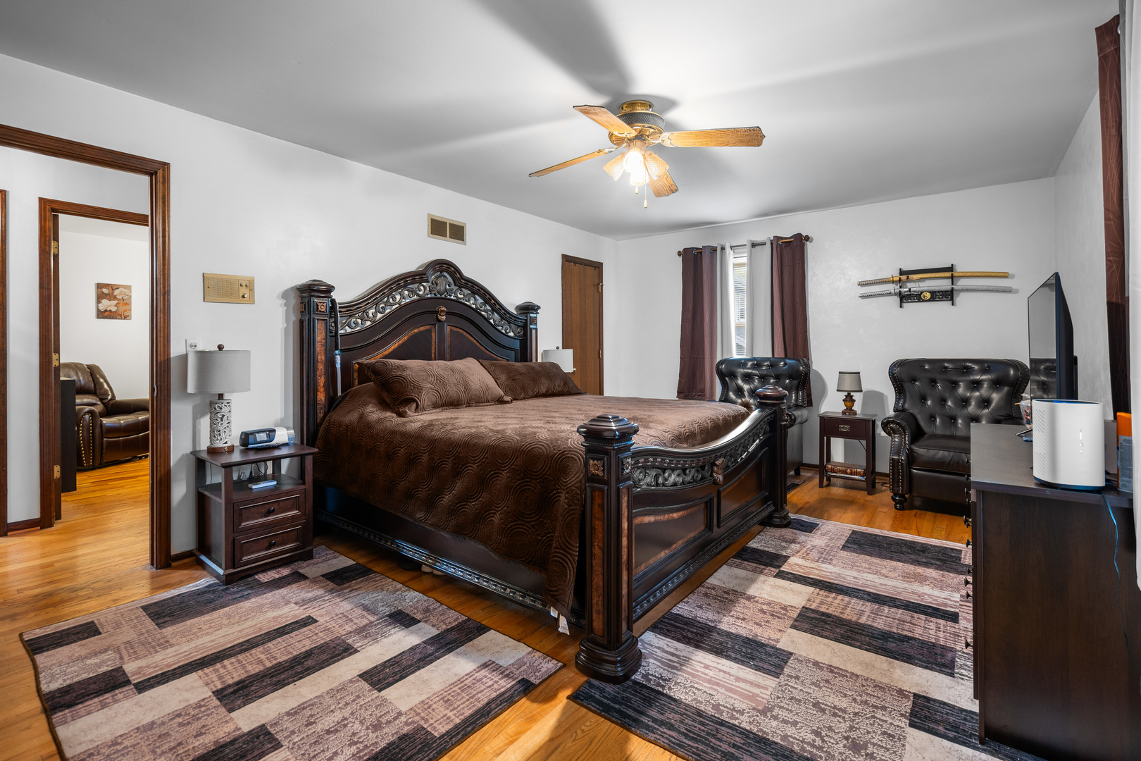 3479 Ronald Road Crete, IL 60417 - Photo 16 of 38 a bedroom with a bed and a chandelier