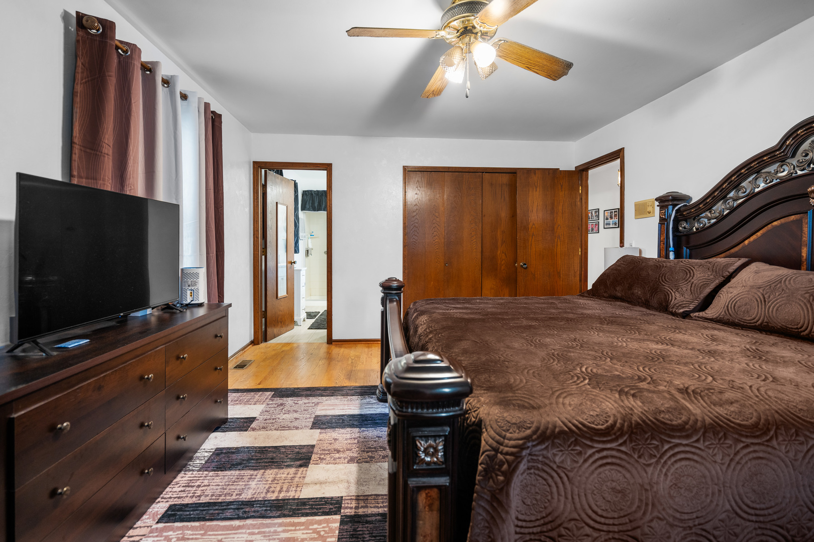 3479 Ronald Road Crete, IL 60417 - Photo 17 of 38 a bedroom with a bed and a flat screen tv