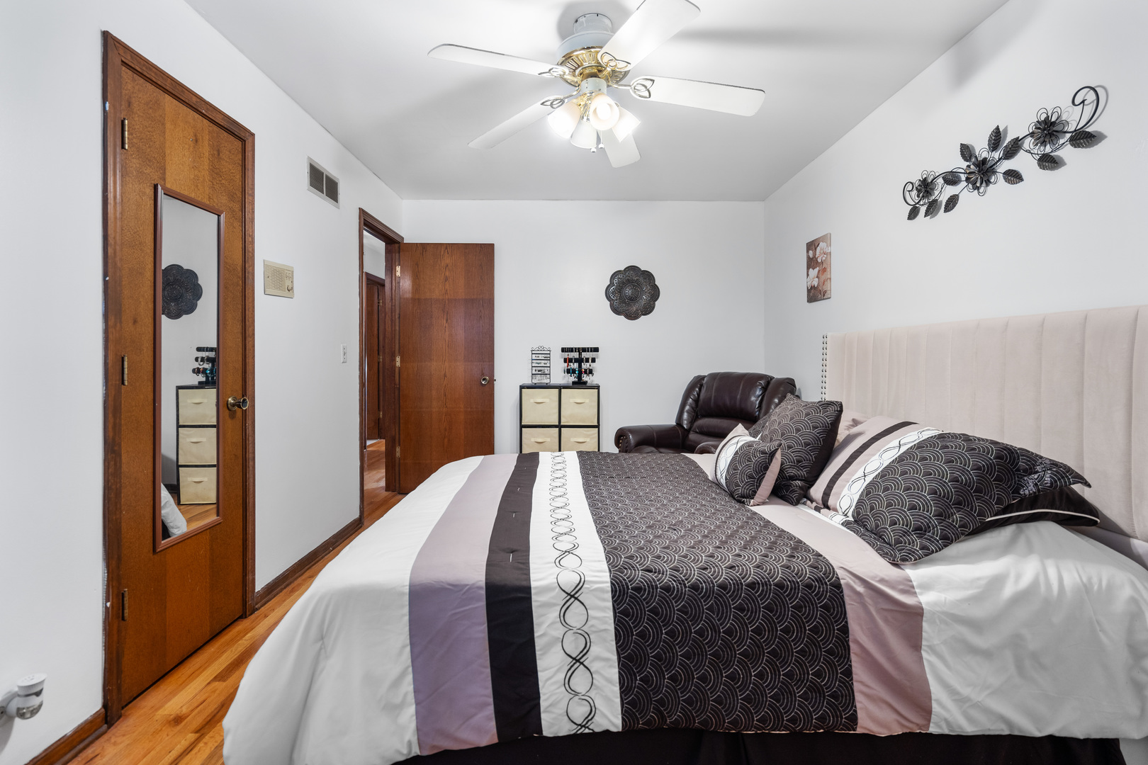 3479 Ronald Road Crete, IL 60417 - Photo 21 of 38 a bedroom with a bed and a chandelier