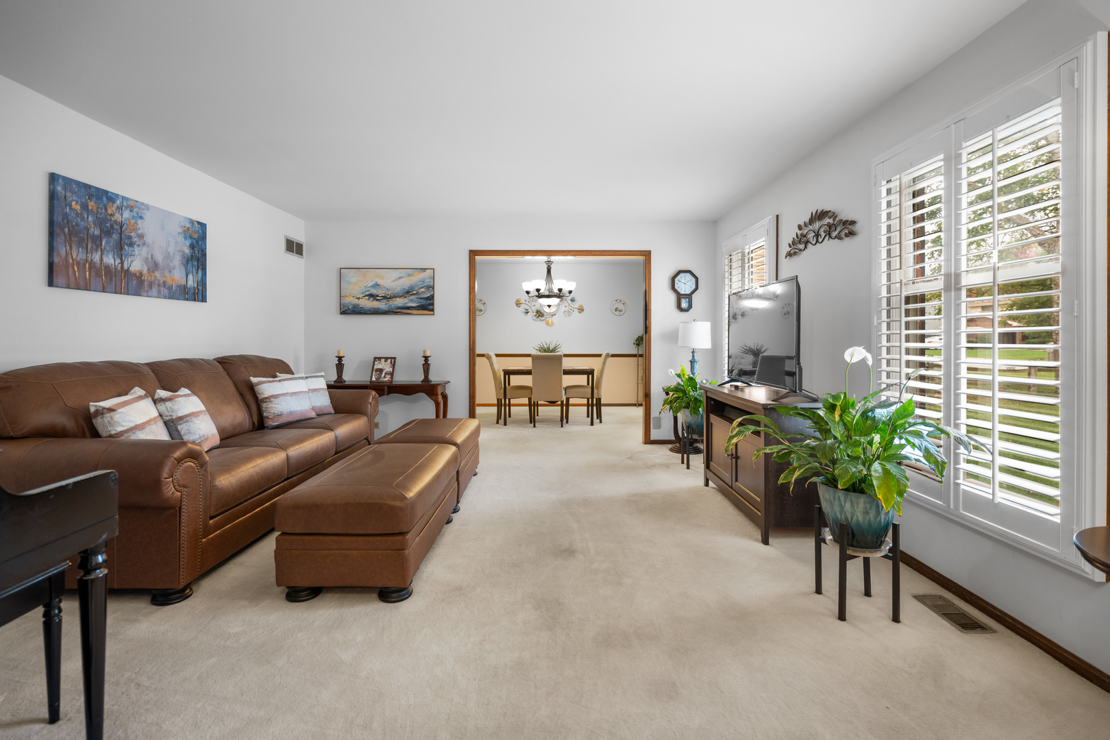 3479 Ronald Road Crete, IL 60417 - Photo 5 of 38 a living room with furniture and a large window with potted plants
