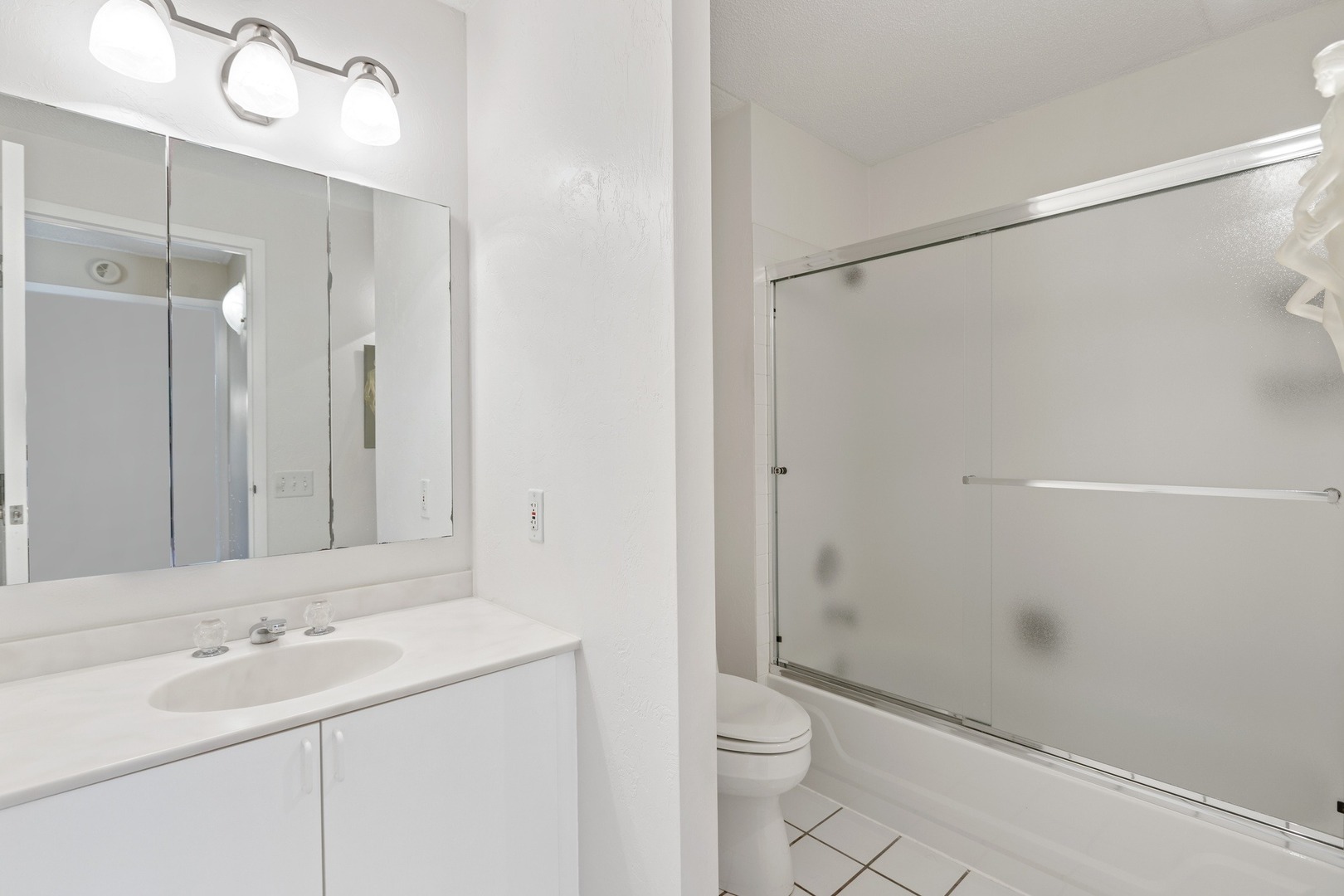 1 Wellington Road Northbrook, IL 60062 - Photo 11 of 27 a bathroom with a shower sink vanity mirror and toilet
