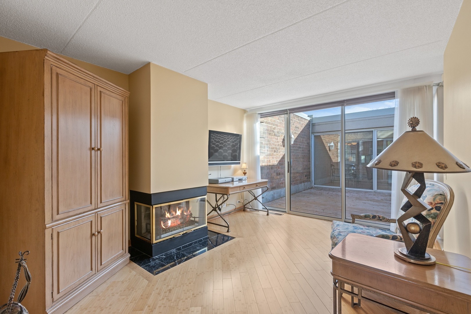 1 Wellington Road Northbrook, IL 60062 - Photo 12 of 27 a living room with stainless steel appliances furniture a sink and a large window