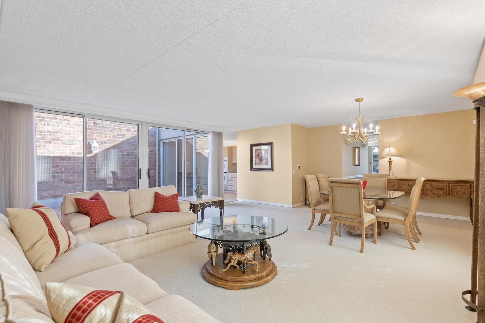 1 Wellington Road Northbrook, IL 60062 - Photo 18 of 27 a living room with furniture a table and a large window