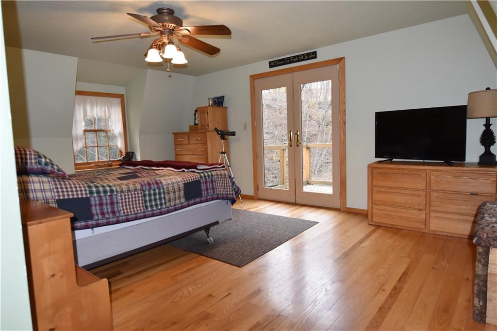 1242 Stitts Run Road Vandergrift, PA 15690 - Photo 12 of 23 a bedroom with furniture and a flat screen tv