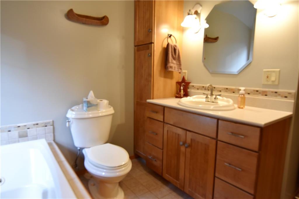 1242 Stitts Run Road Vandergrift, PA 15690 - Photo 13 of 23 a bathroom with a sink vanity mirror and toilet