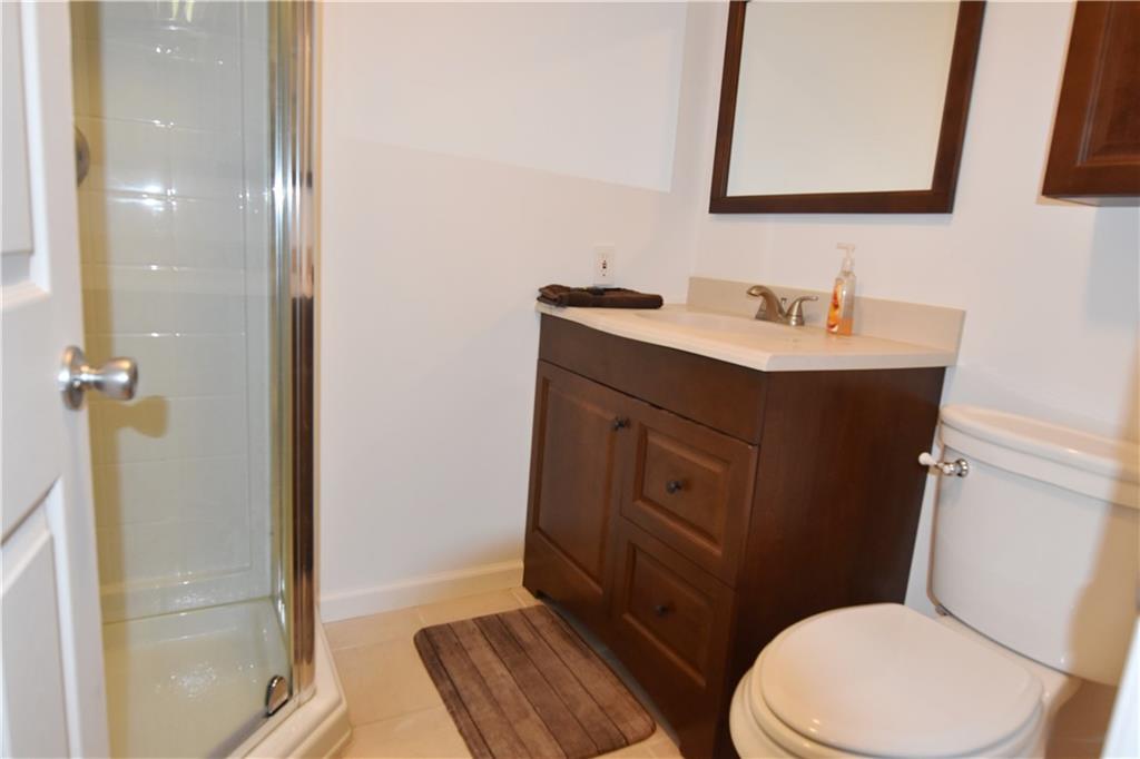 1242 Stitts Run Road Vandergrift, PA 15690 - Photo 17 of 23 a bathroom with a sink a toilet a mirror and shower
