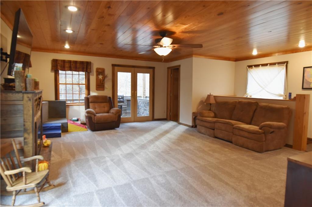 1242 Stitts Run Road Vandergrift, PA 15690 - Photo 10 of 23 a living room with furniture and a chandelier