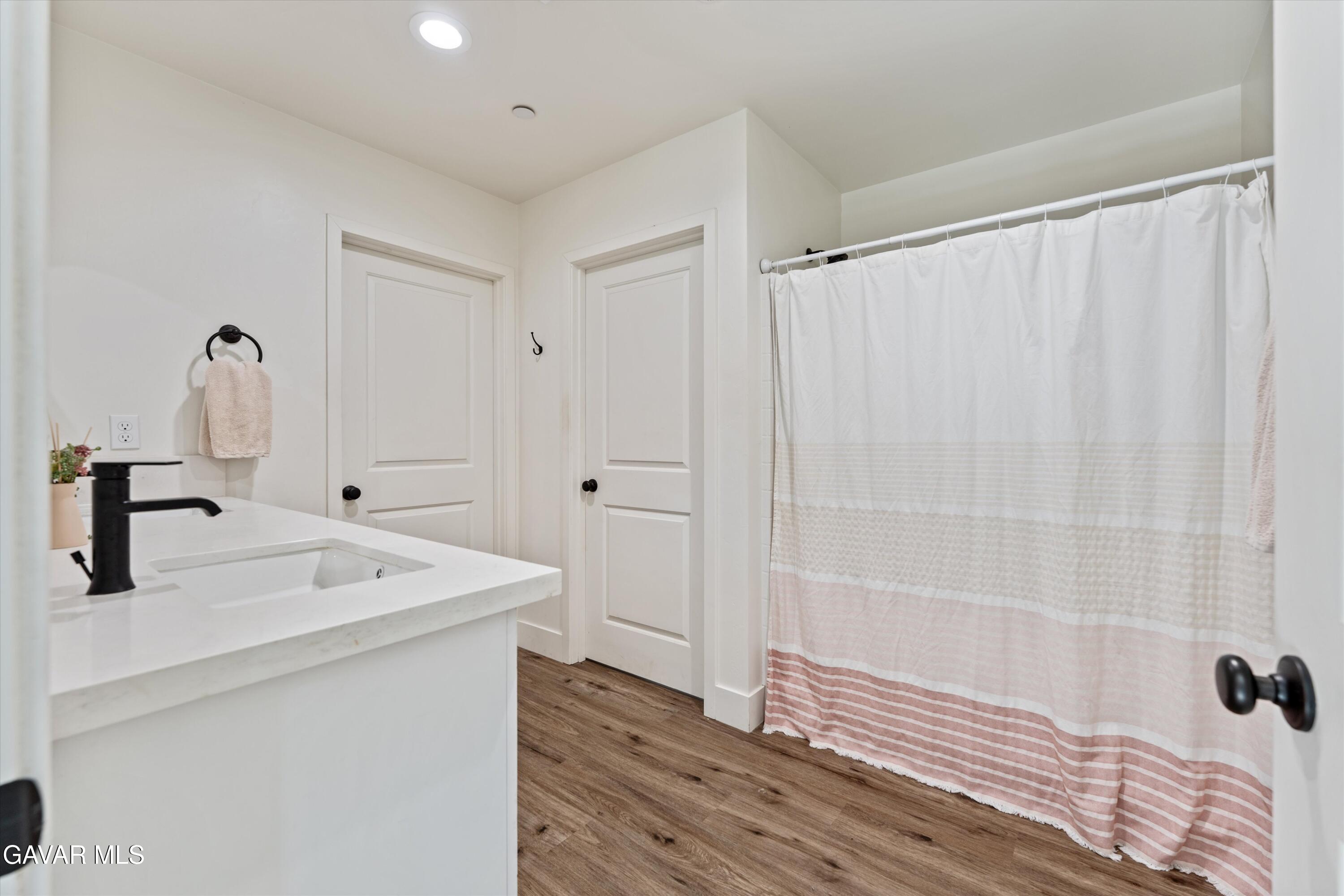 28060 Preakness Drive Tehachapi, CA 93561 - Photo 14 of 26 a bathroom with a sink and a mirror