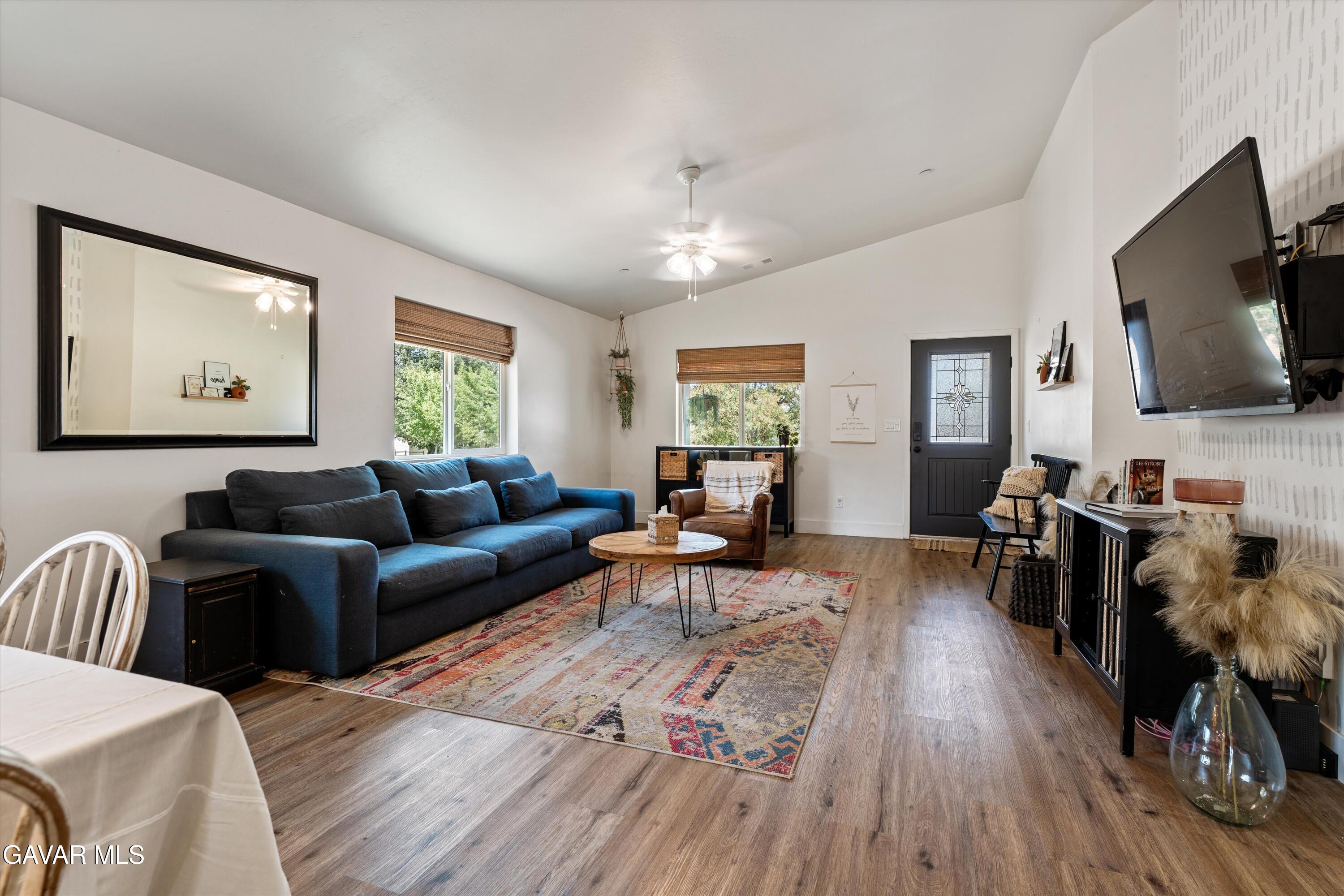 28060 Preakness Drive Tehachapi, CA 93561 - Photo 8 of 26 a living room with furniture and a flat screen tv