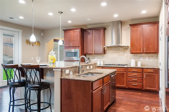 a kitchen with a sink cabinets and window